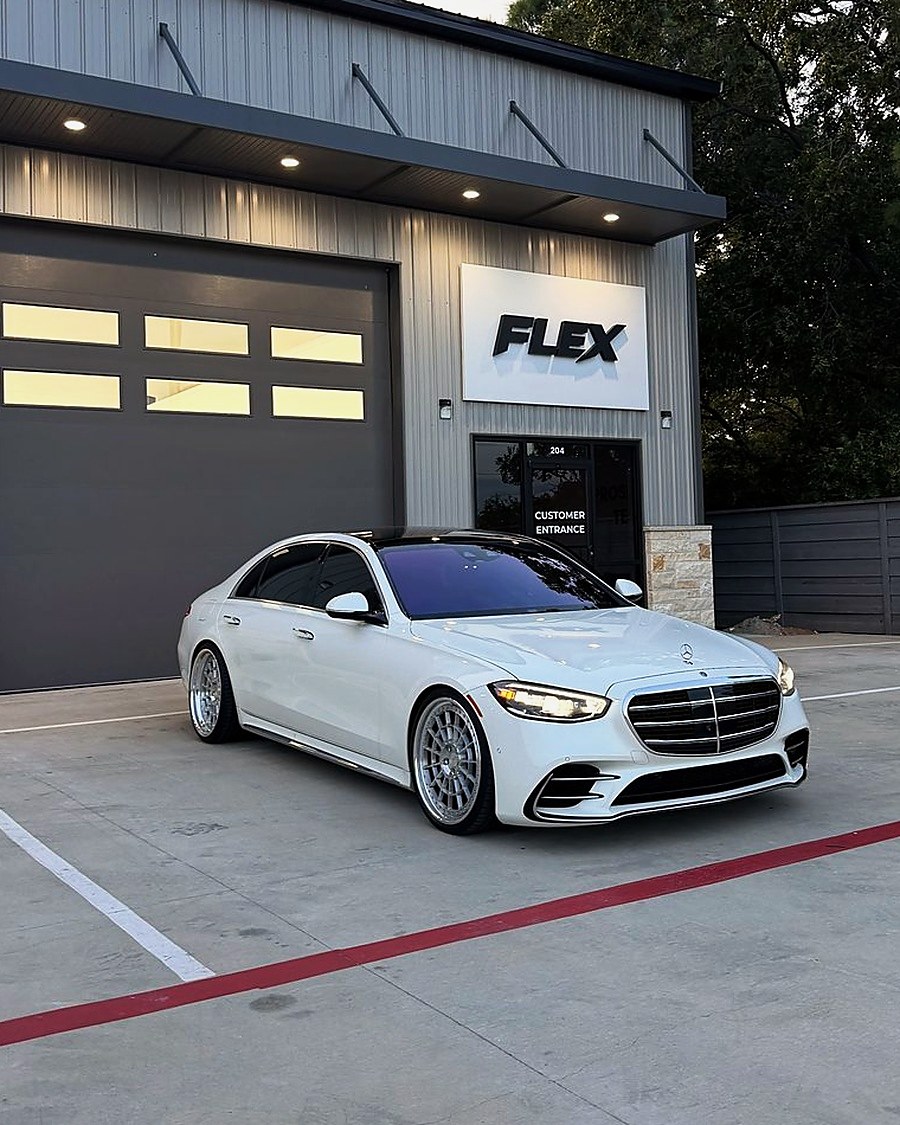 White Mercedes S-Class outside the FLEX shop