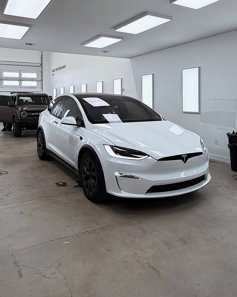 White Tesla Model X in the FLEX shop
